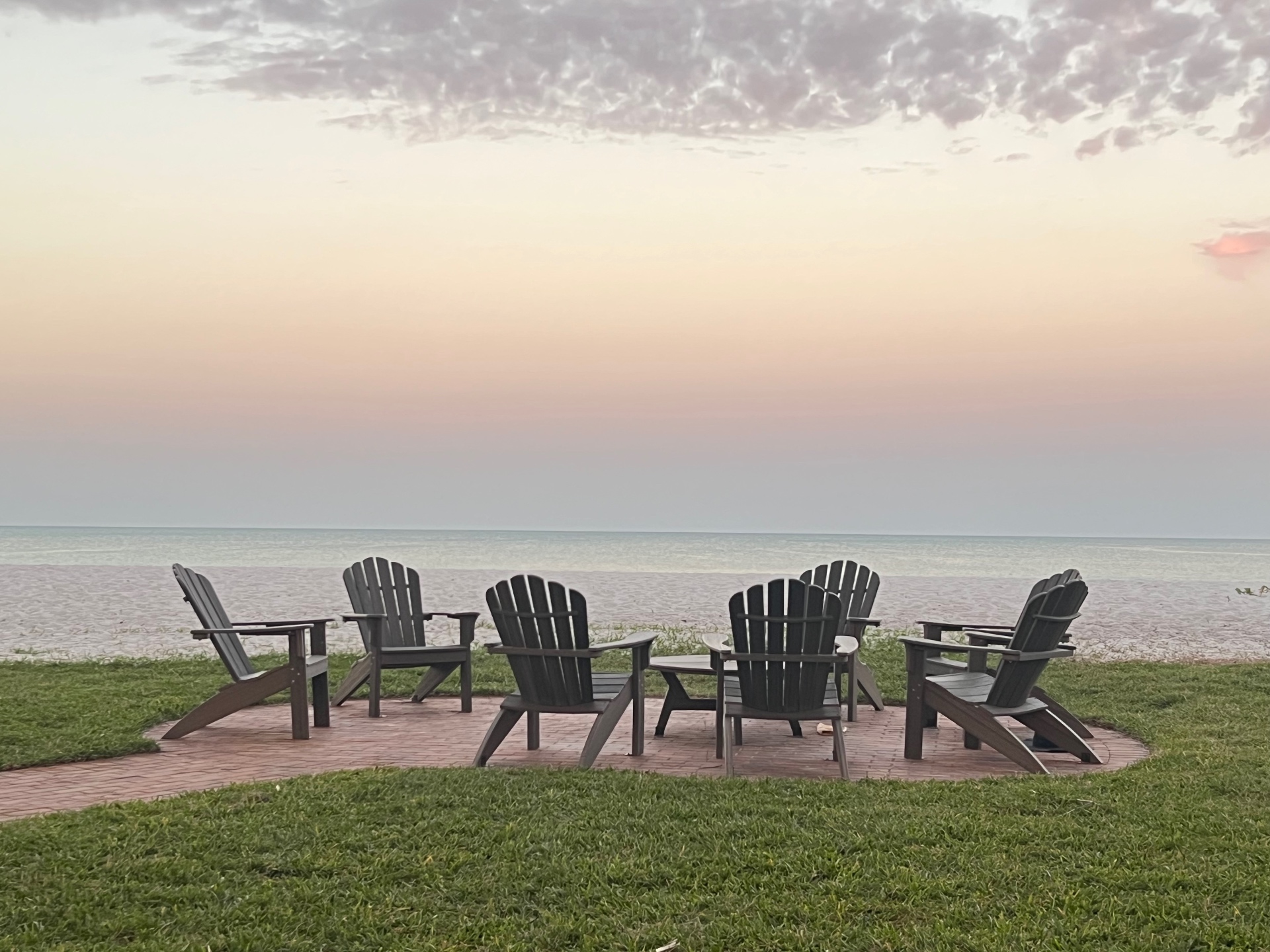 Beachfront gathering area at sunset