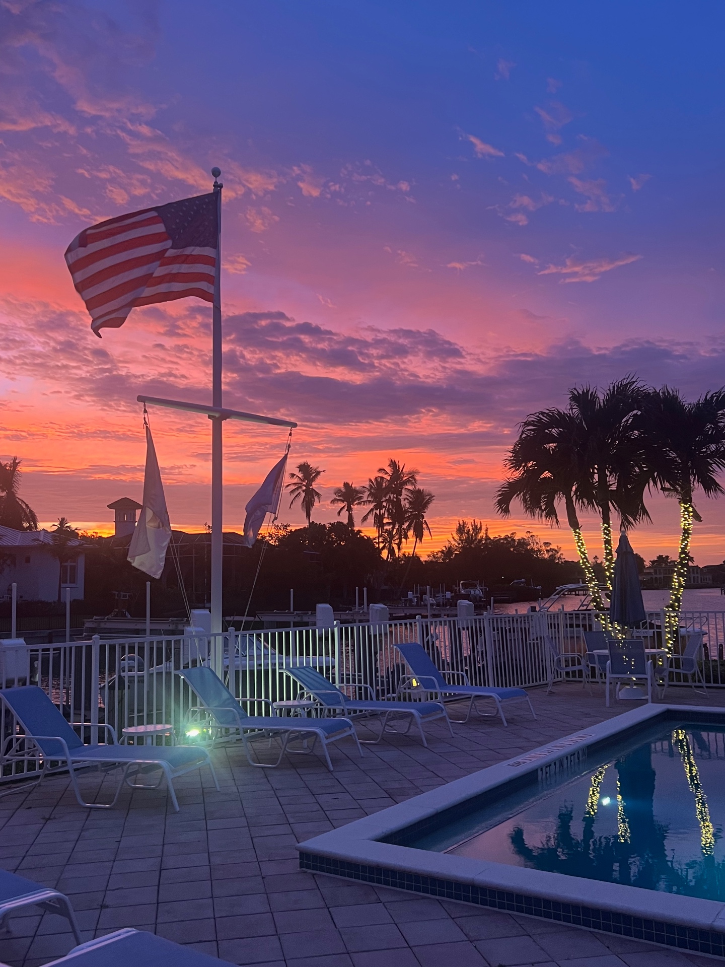Sunset over the pool and marina